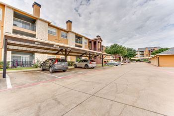 Covered carport parking area with resident vehicles